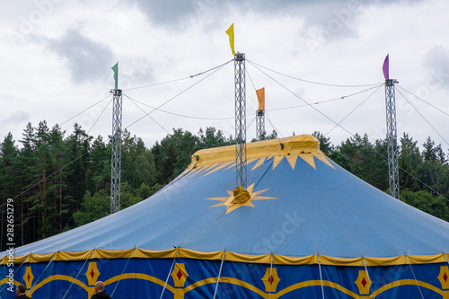 Photo of a mobile blue top circus in the summer forest