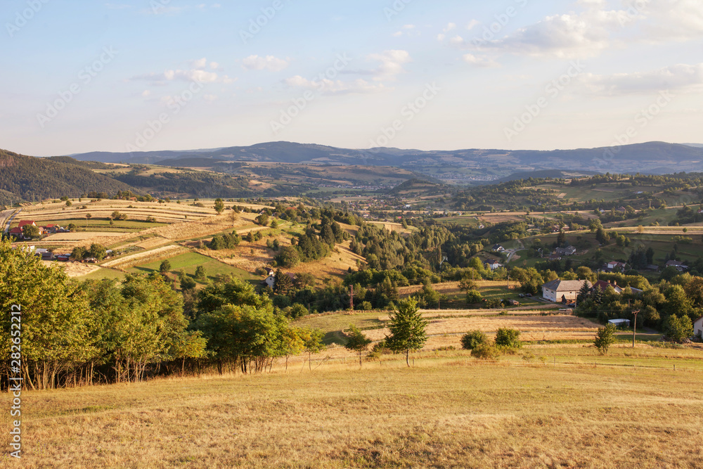 Nature and environment. Fields and hills. Mountain landscape in the summer. Travel, tourism and agriculture. Slovakia