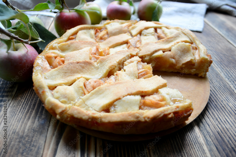 Homemade delicious Apple pie on wooden background Autumn baking Homemade delicious Apple pie on wooden background Autumn baking