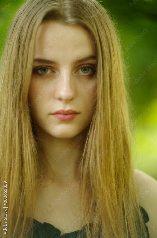 beautiful young blonde with long flowing hair and blue eyes beautiful young blonde with long flowing hair and blue eyes