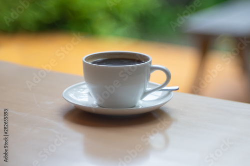 Hot Coffee cup on the wooden table as beverage background