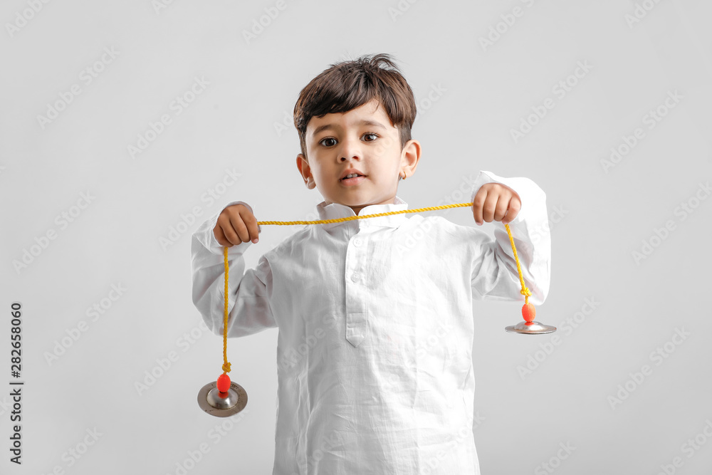 Indian Little Boy in Traditional Dress and learning with Musical instrument Indian Little Boy in Traditional Dress and learning with Musical instrument