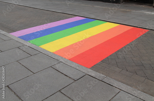 A LGBT Rainbow Painted on a Public Paved Road.