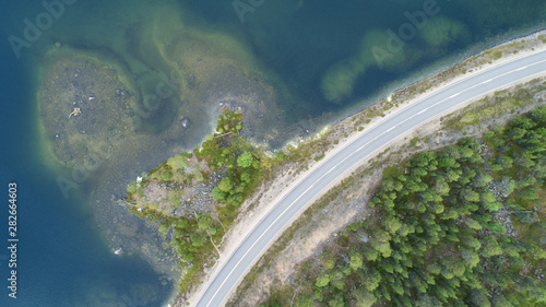 Curving road along lake during summer © raland