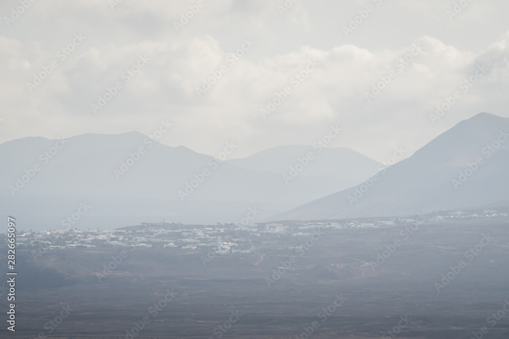 Mountains of Lanzarote in the sunny mist of daylight - Lanzarote, Spain
