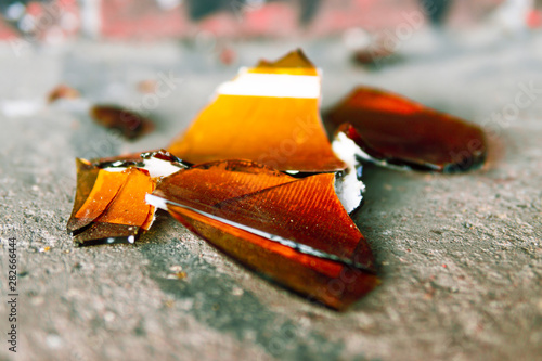 Photography A broken bottle lies on the road. Dangerous glass shards