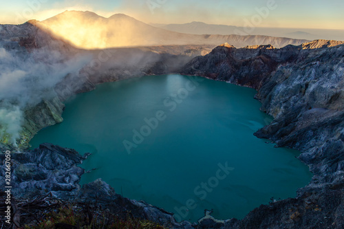 Beautiful sunrise on the mount and sulfur fumes from the crater of Kawah Ijen Volcano in Indonesia