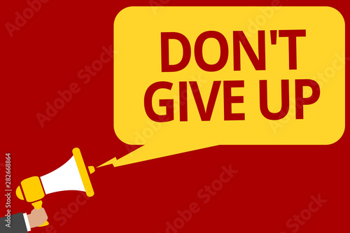 Handwriting text writing Don t not Give Up. Concept meaning Determined Persevering Continue to Believe in Yourself Man holding megaphone loudspeaker speech bubble message speaking loud photo