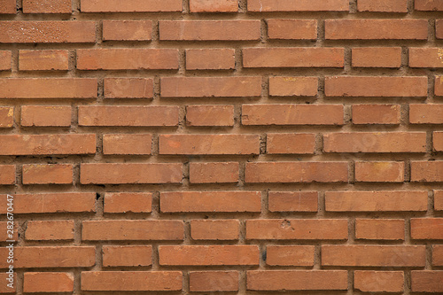 Background of stones and cobblestones. Fragment of a brick wall.