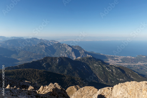 Beautiful landscape in the mountains. Lovely view of the Taurus Mountains and the Mediterranean coast from the top of mount Tahtali. Kemer, Turkey. Postcard view