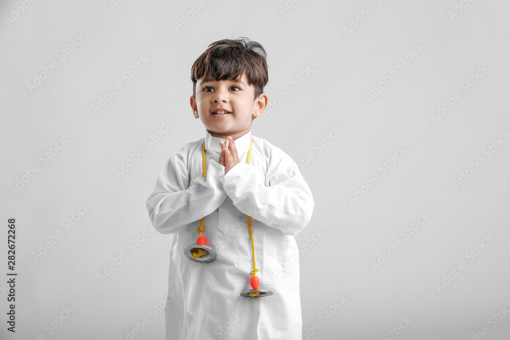 Indian Little Boy in Traditional Dress and learning with Musical instrument Indian Little Boy in Traditional Dress and learning with Musical instrument