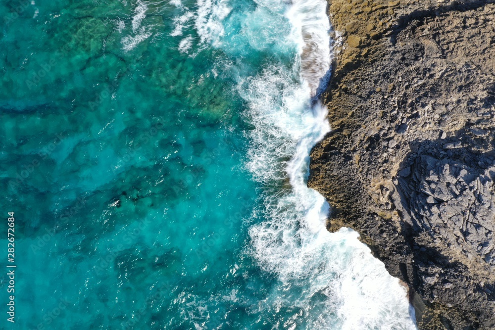 Aerial view to ocean waves and coast Aerial view to ocean waves and coast