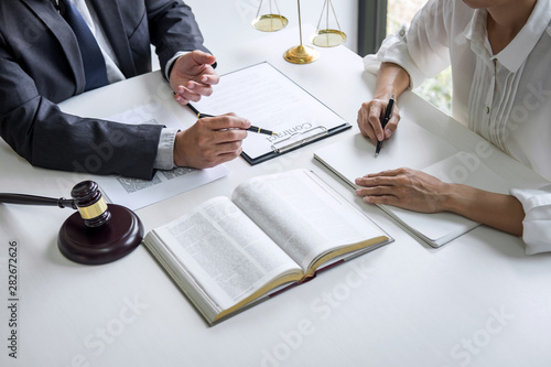 Businesswoman and Male lawyer or judge consult and conference having team meeting with client at law firm in office, Law and Legal services concept photo