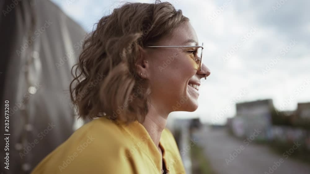 closeup of a young woman. smiling in slowmotion closeup of a young woman. smiling in slowmotion