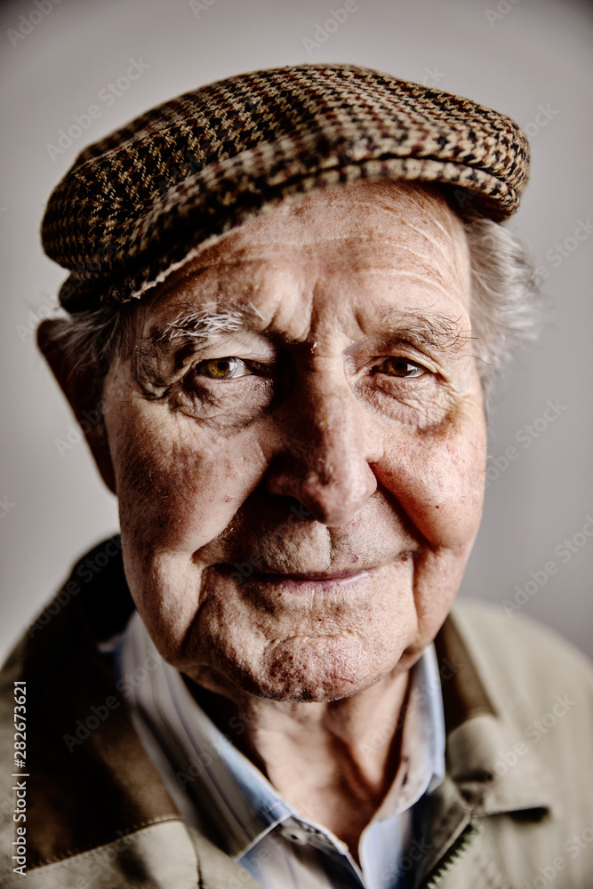 Portrait of smiling senior man wearing cap Portrait of smiling senior man wearing cap