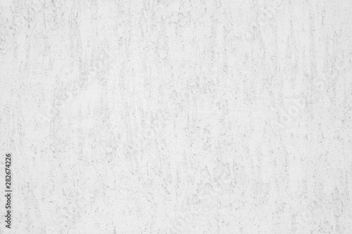 Neutral white colored low contrast Concrete textured background with roughness and irregularities to your concept or product.