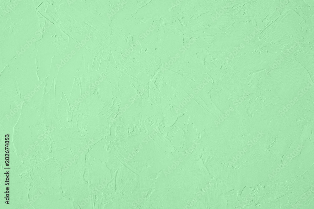 Trendy mint colored low contrast Concrete textured background with roughness and irregularities to your design or product. Year color trend concept. Trendy mint colored low contrast Concrete textured background with roughness and irregularities to your design or product. Year color trend concept.