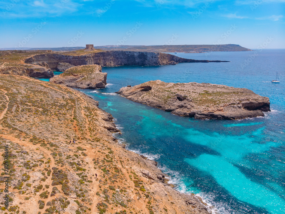 Panorama of Blue Lagoon Comino Malta. Cote Azur, turquoise clear water with white sand. Aerial view Panorama of Blue Lagoon Comino Malta. Cote Azur, turquoise clear water with white sand. Aerial view