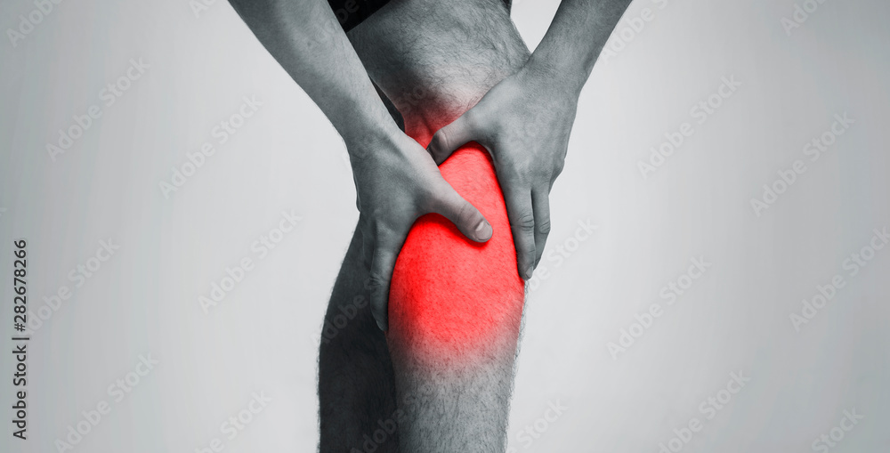 Seinätarra Man massaging his painful knee, black and white photo
