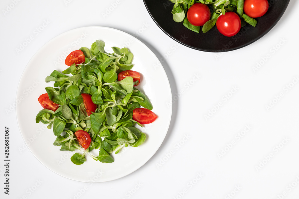 Fresh green salad isolated on white background, flat lay. Fresh green salad isolated on white background, flat lay.