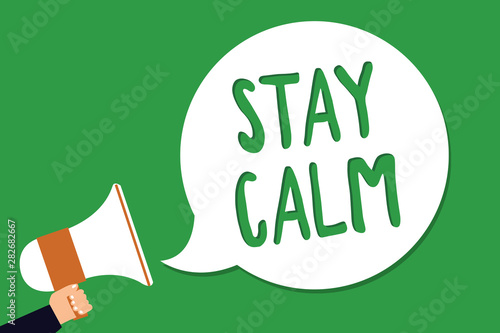 Conceptual hand writing showing Stay Calm. Business photo showcasing Maintain in a state of motion smoothly even under pressure Man holding megaphone loudspeaker screaming green background photo