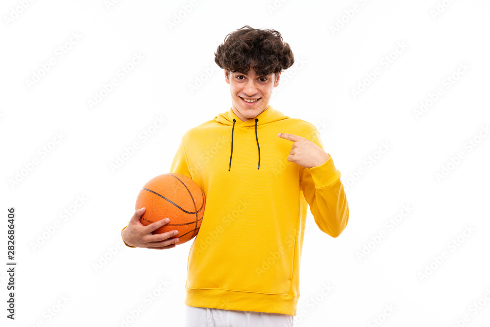 Young basketball player man over isolated white wall with surprise facial expression
