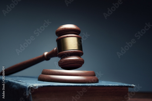 wooden judge on book on the desk