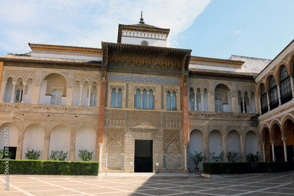 Fototapeta premium Seville / Spain – September 15 2018: An ornate entrance inside the Alcazar palace in Seville