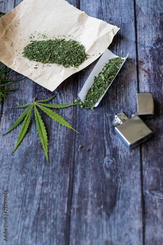 Marijuana herb Cook rolling hemp. Drug use. Drugs narcotic concept.