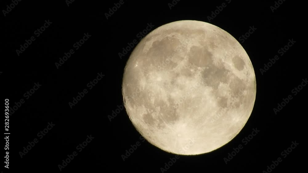 Moon With Clouds In The Night Sky. Concept of a spooky theme and mystery. Mysterious night sky with moon and dramatic clouds passing. Dark night with moon. Moon With Clouds In The Night Sky. Concept of a spooky theme and mystery. Mysterious night sky with moon and dramatic clouds passing. Dark night with moon.