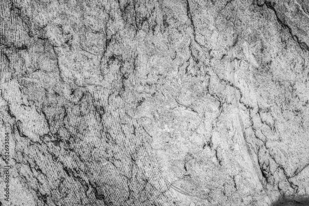 Texture of black and white raw marble with traces of saw for the background. Texture of black and white raw marble with traces of saw for the background.