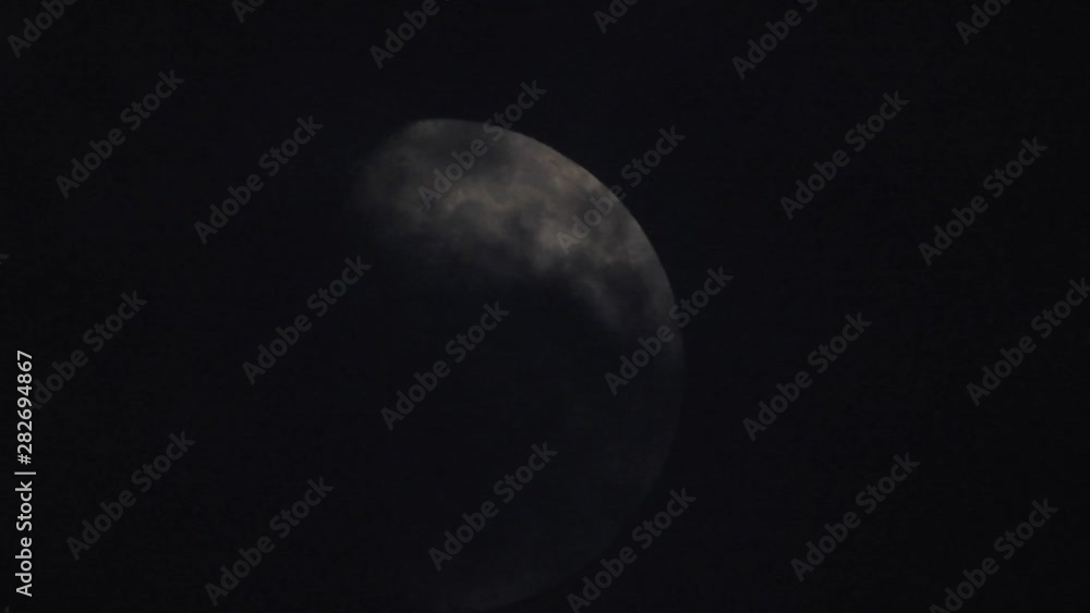 Moon With Clouds In The Night Sky. Concept of a spooky theme and mystery. Mysterious night sky with moon and dramatic clouds passing. Dark night with moon. Moon With Clouds In The Night Sky. Concept of a spooky theme and mystery. Mysterious night sky with moon and dramatic clouds passing. Dark night with moon.