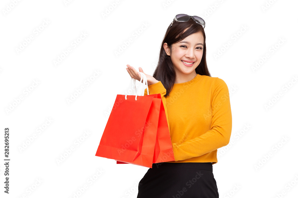 Portrait of a happy young woman holding shopping bags isolated over white background, Year end sale or mid year sale promotion clearance for Shopaholic concept, Asian female model Portrait of a happy young woman holding shopping bags isolated over white background, Year end sale or mid year sale promotion clearance for Shopaholic concept, Asian female model