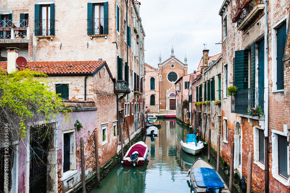 Scenic canal with old architecture in Venice, Italy. Famous travel destination