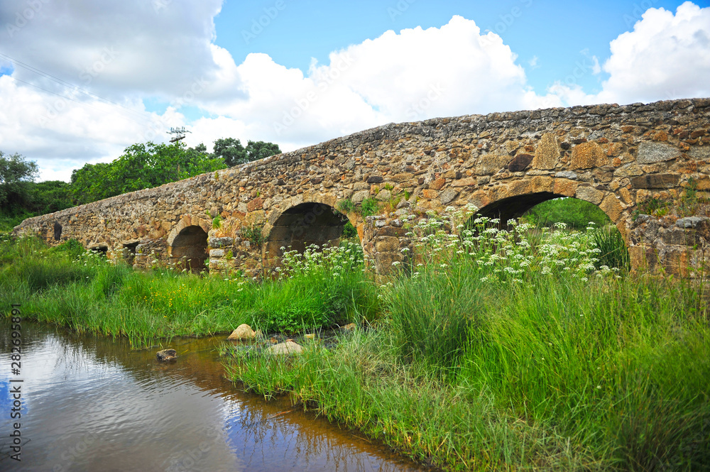 Roman bridge over the Ayuela river in  Casas de Don Antonio village in the  province of Caceres Extremadura Spain. Here cross the Via de la Plata towards Santiago de Compostela.