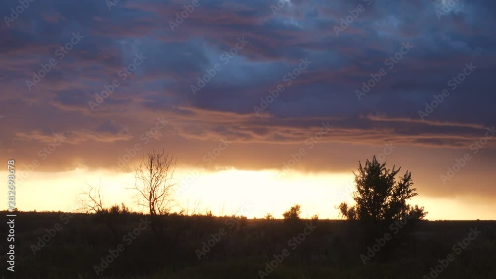 heavy stormy clouds over the evening field heavy stormy clouds over the evening field