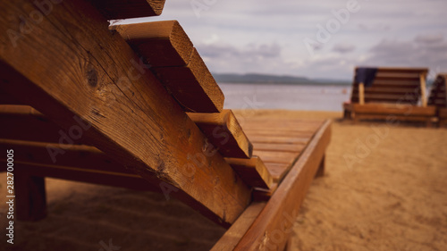 wooden lounge chair on the beach © Sean David