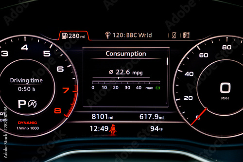 Fuel consumption display in instrument cluster of modern car. Fuel economy is one of the most important factors to consider when buying a new car. Car gas mileage theme, fuel consumption concept