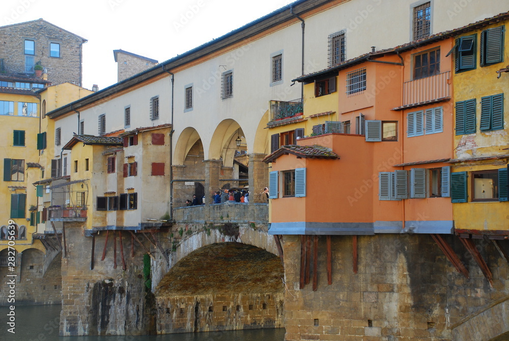 The famous Ponte Vecchio bridge in Florence, Italy, lined with houses and shops