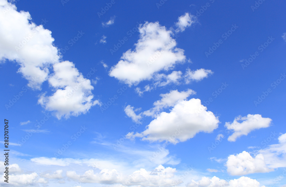 Obraz premium Blue sky background with tiny clouds.