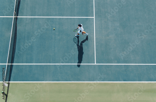 Professional tennis player playing on club court © Jacob Lund