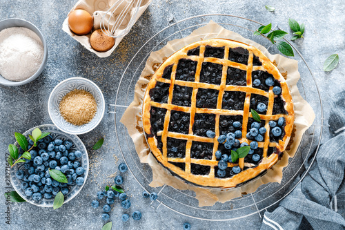 Fotografie Traditional homemade american blueberry pie with lattice pastry, top view