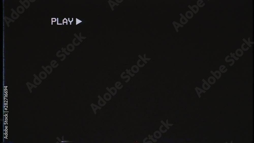 Movements of an old damaged VHS tape with tv flicker antenna noise: play, fast forward, rewind, stop, eject. Cool retro vintage background for modern videos.