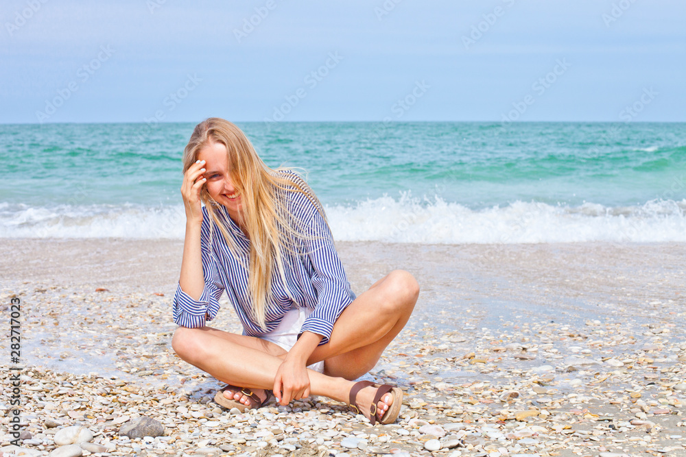 Beautiful happy girl on the Adriatic beach. Travel and vacation. Beautiful happy girl on the Adriatic beach. Travel and vacation.