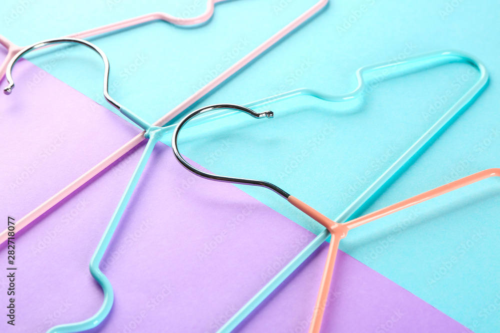 Clothes hangers on color background Clothes hangers on color background