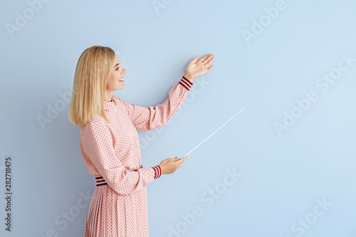 Beautiful female teacher wi...