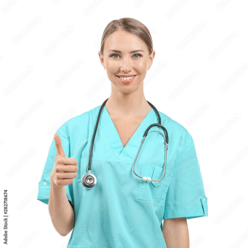 Female nurse with stethoscope showing thumb-up on white background Female nurse with stethoscope showing thumb-up on white background