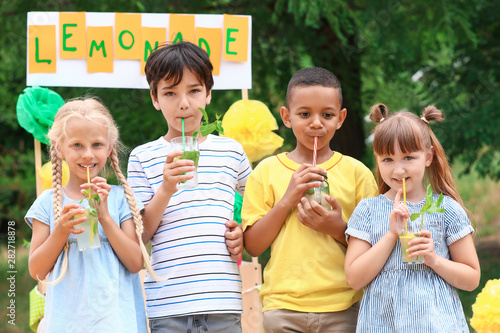 Cute little children drinki...