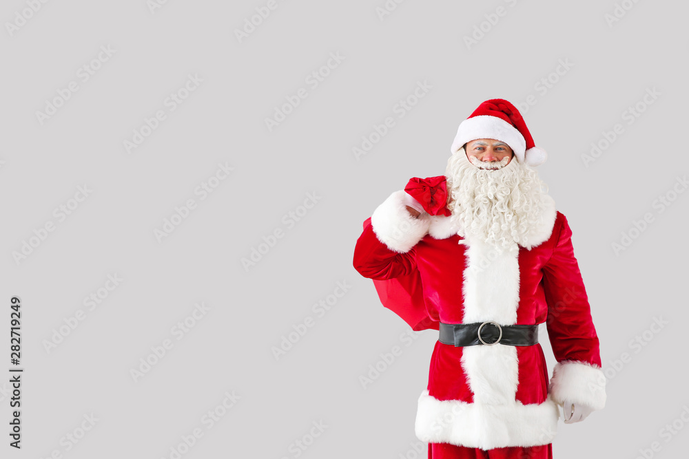Portrait of Santa Claus with bag on light background Portrait of Santa Claus with bag on light background