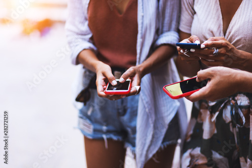 Technology and people concept,close up people holding smartphones